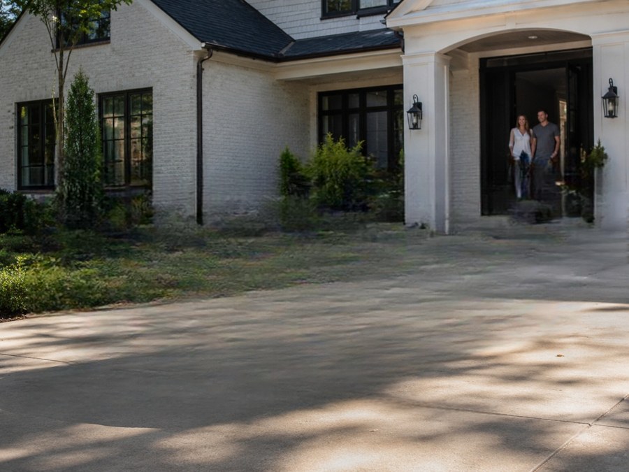 The same driveway, car removed — shadow and all — after